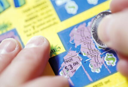 Scratching-Off-a-Lotto-Ticket_GettyimagesIngramPublishing