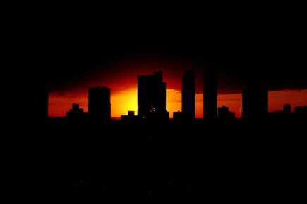 Silhouette-Skyscrapers-Against-Orange-Sky-_GettyimagesRamzi-RizkEyeEm.