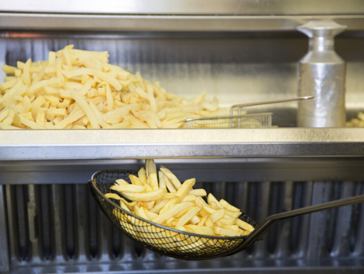 Close-up-of-French-fries-cooking_GettyimagesGrant-Faint