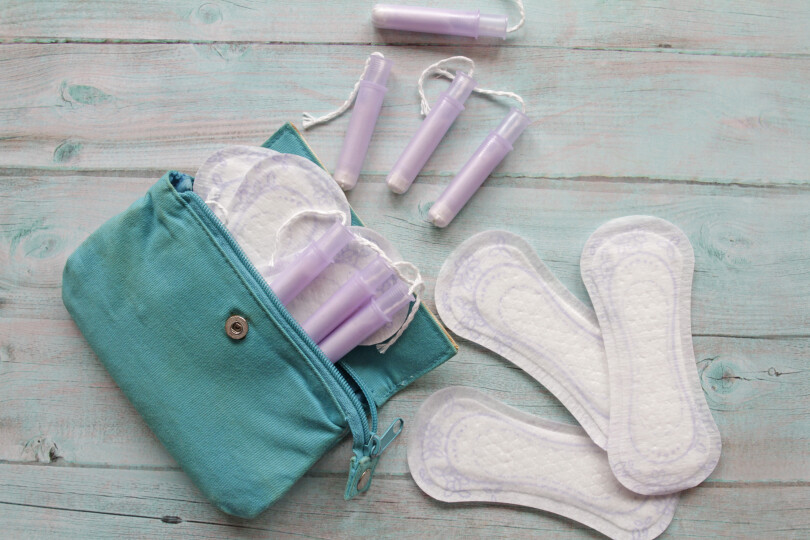 Menstrual-bag-with-cotton-tampons-and-sanitary-pads-Photos_GettyimagesIsabel-Pavia