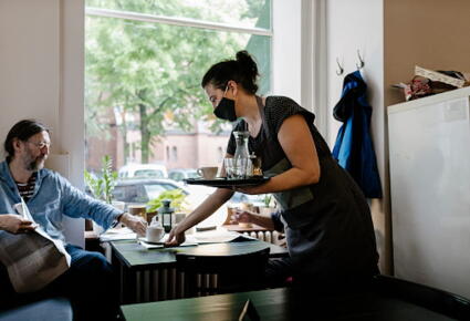 Waitress-Wearing-Face-Mask-Serving-Customer-In-Restaurant_GettyimagesWillie-B.-Thomas
