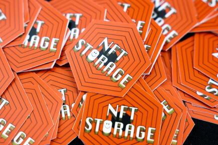 DENVER, CO - FEBRUARY 18: NFT stickers sit at a booth at ETHDenver on February 18, 2022 in Denver, Colorado. ETHDenver is the largest and longest running Ethereum Blockchain event in the world with more than 15,000 cryptocurrency devotees attending the weeklong meetup. Michael Ciaglo/Getty Images/AFP (Photo by Michael Ciaglo / GETTY IMAGES NORTH AMERICA / Getty Images via AFP)