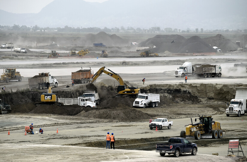 Bulldozers and trucks are seen at the construction site of a new international airport which will be called 'General Felipe Angeles' at the Santa Lucia Air Force Base in Zumpango, near Mexico City, on October 16, 2020. - Mexican President Andres Manuel Lopez Obrador visited the construction of the airport, which has a progress of 40.1%. (Photo by ALFREDO ESTRELLA / AFP)