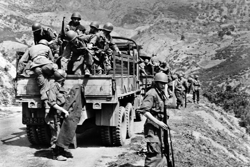 French troops prepare to enter the maquis in the region of Tlemcen Nedromah on April 27, 1956 during military operations, during the Algerian War. (Photo by Jacques GREVIN / AFP)