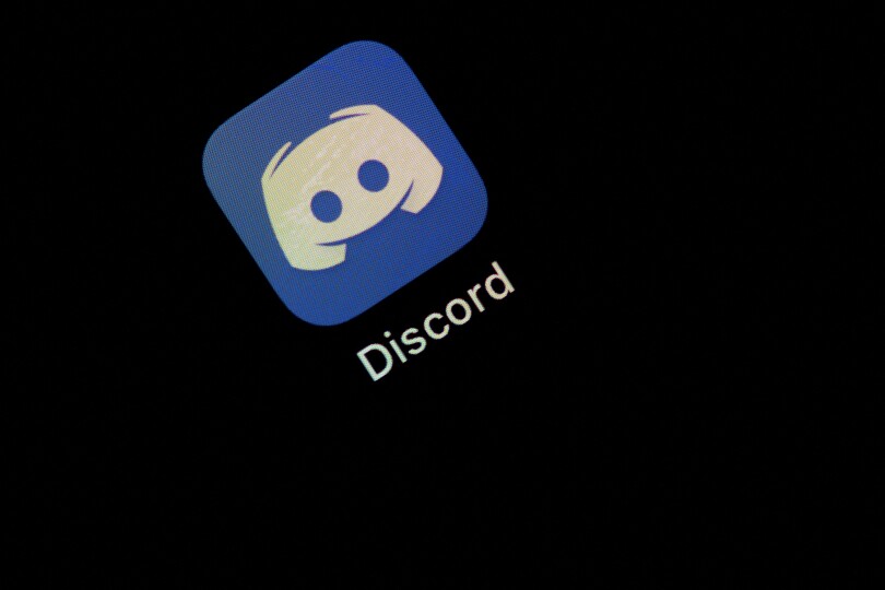 This illustration picture taken on May 27, 2020 in Paris shows the logo of the social network application Discord on the screen of a phone. (Photo by Martin BUREAU / AFP)
