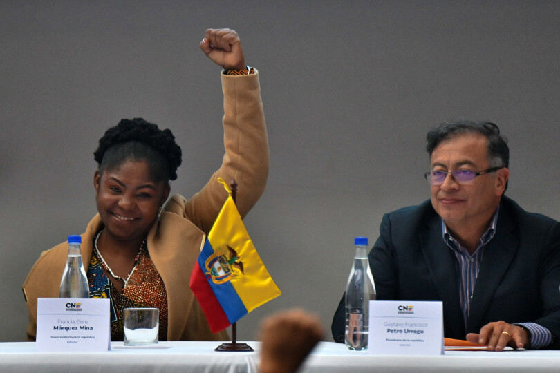 Colombian vice president-elect Francia Marquez (L) gestures next to president-elect Gustavo Petro during a ceremony at the headquarters of the National Registry of Civil Status to receive their official credentials, in Bogota, on June 23, 2022. - Petro, who became the country's first ever left-wing president after getting 50.44 percent of the vote in the runoff election, has promised to invest in healthcare and education, increase taxes on the wealthiest and suspend oil exploration, giving pride of place to renewable energy sources. (Photo by Juan BARRETO / AFP)