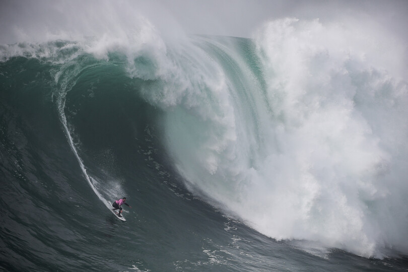 French surfer Eric Rebiere rides a wave during the Tudor Nazare Tow Surfing Challenge at Praia do Norte in Nazare on February 10, 2022. (Photo by CARLOS COSTA / AFP)