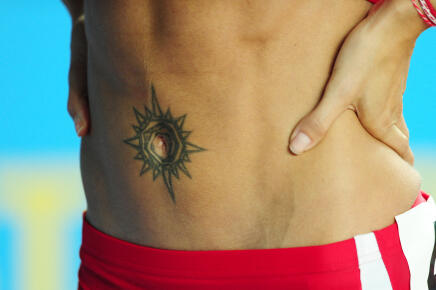 A picture shows the tattoo around Bulgaria's Ivet Lalova's navel after her race in the women's 60m qualifications at the 2012 IAAF World Indoor Athletics Championships at the Atakoy Athletics Arena in Istanbul on March 10, 2012. AFP PHOTO / ARIS MESSINIS (Photo by ARIS MESSINIS / AFP)