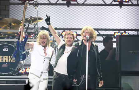 Bassist Rick Savage, drummer Rick Allen, and singer Joe Elliott of Def Leppard